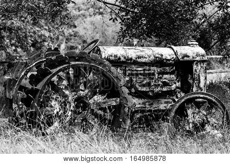 Old Abandoned Tractor In The Field