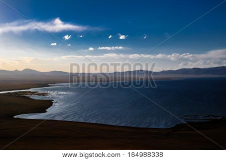 Panorama of Song Kul lake at the sunset Kyrgyzstan
