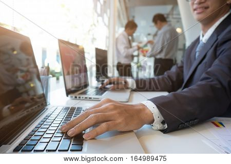 businessman working plan the business and analysis on laptop. Film effected photo.