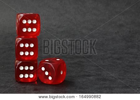 Picture of four playing dice on pocker.