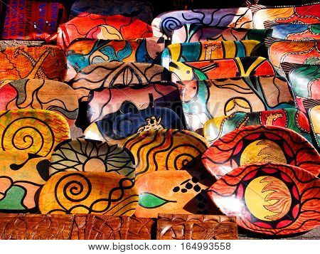 Hazyview, South Africa - April 25, 2014: Colorful clay pottery crockery with painting wild nature and animals. African art style. Local craft market.