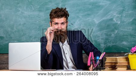 Teacher Formal Wear Sit Table Classroom Chalkboard Background. Teacher Concentrated Bearded Mature S