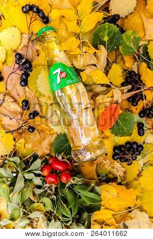 Saint-petersburg, Russia, 17102018 Drink 7up In A Glass Tin Bottle On Autumn Yellow Green Foliage Of