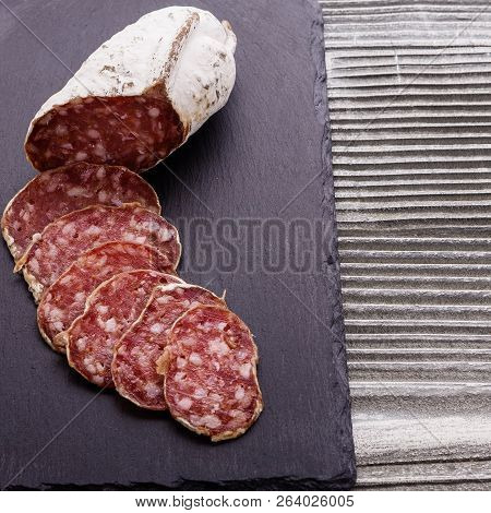 Saucisson Sec Delicious French Salami On A Wooden Background
