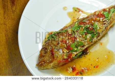Crispy Fried Sharp Tooth Snapper Dressing With Sweet Chili Sauce On Plate