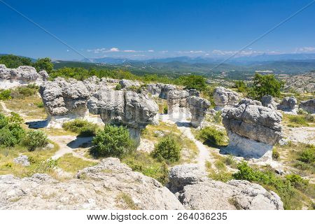 Forcalquier Mushroom-shaped Rock Formations In Les Mourres Nature Park In France During A Sunny Day