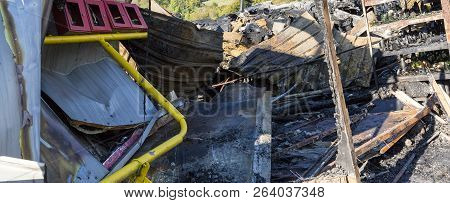 Damaged Industry Supermarket After Arson Fire With Burn Debris Of Twisted Metal Wood Structure After