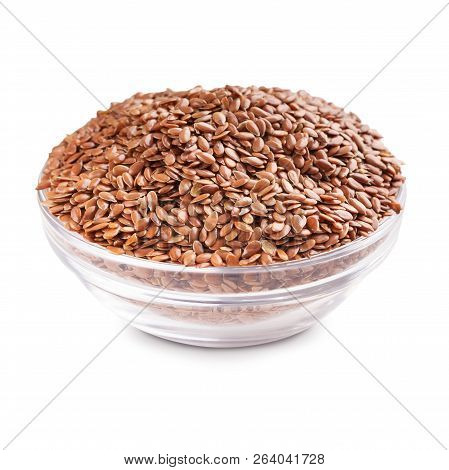 Linseeds In Glass Bowl Isolated On White Background