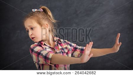 Little Girl Saying Thanks But No. Cute Child Denying Proposal, Making Stop Gesture With Her Hands, C