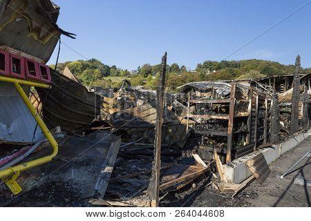 Damaged Industry Supermarket Metallic Facade After Arson Fire With Burnt Debris After Intense Burnin