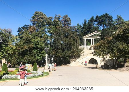 Kislovodsk, Russia - September 19, 2018: People On Lermontov Square Near Colonnade Gate Of Park In K