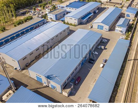 Aerial Top View Of Warehouses Hangars Near The Industrial Factory Zone