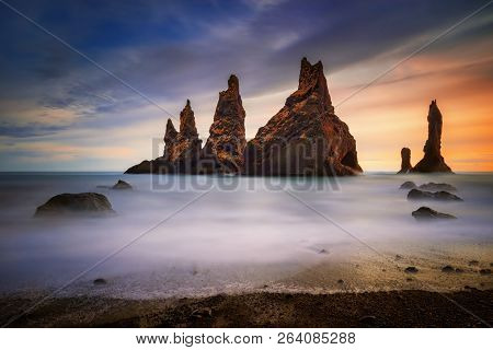 Rocks On Black Beach Reynisfjara At Sunset, Iceland