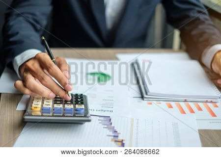 Businessman Using Calculator For Analysis Maketing Plan, Accountant Calculate Financial Report, Smar