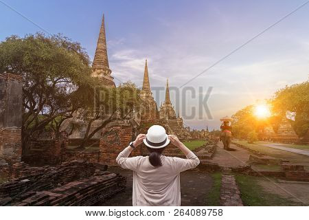 Foreign Tourists Elephant Ride To Visit Ayutthaya, There Are Ruins And Templesi In The Ayutthaya Per