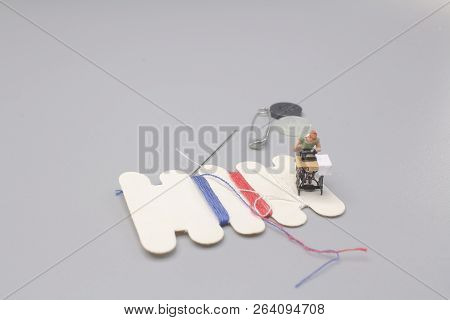 A Mini Of Dress Maker Woman Working