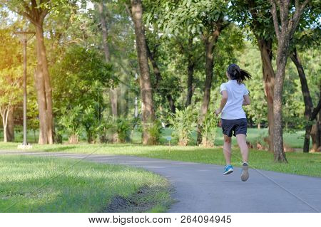 Young Fitness Woman Running In The Park Outdoor, Female Runner Walking On The Road Outside, Asian At