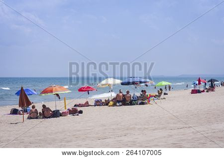 Catania, Sicily, Italy - August 15, 2018: People Relax On The Beach Lido Azzurro