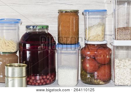 Storage Shelves In Pantry With Homemade Canned Preserved Fruits And Vegetables