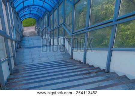Stairs To Elevated Pedestrian Crossing From The Inside. Safe Passage Across The Road.