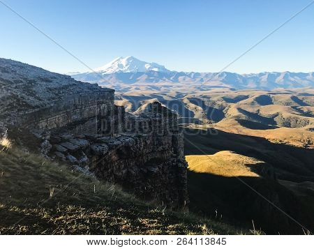 Travel To North Caucasus Region Region - View Of Mount Elbrus And Rocks Of Bermamyt Plateau At Septe