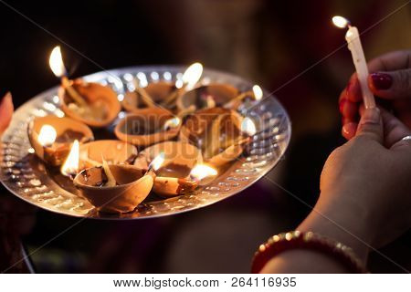 Earthen Diya Lamp Lighting With Candles On The Occasion Of Diwali And Sandhi Pujo