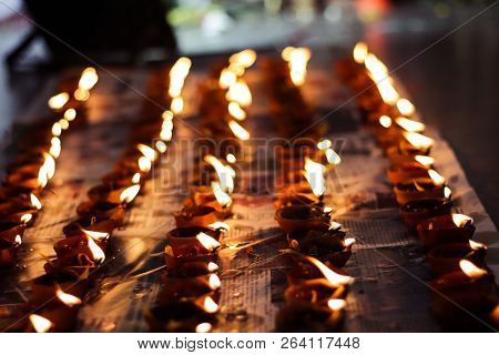 Earthen Diya Lamp Lighting With Candles On The Occasion Of Diwali And Sandhi Pujo
