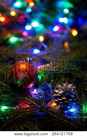 A Red Golden Ball And A Lump On A Tree Branch Among The Multicolored Lights. Congratulations On The 