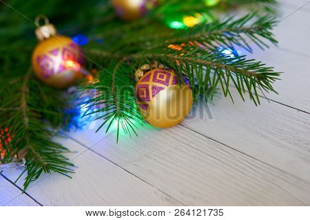 Christmas Tree, Decorated With Toys And Colorful Lights, On A Light Background. Congratulations On T
