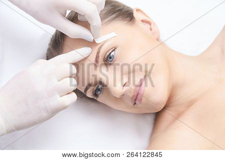 Unwanted Hair Wax Epilation. Young Woman. Cosmetology Salon Treatment Procedure. Home Waxing