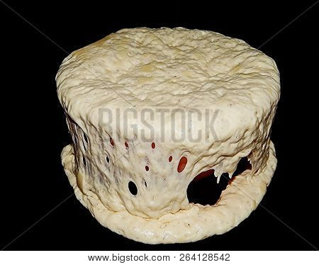 Homemade Leavened Dough, The Dough Ran Away. Inattentive Housewife.white Dough On A Black Background