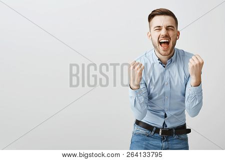 Man Singing From Heart Being Carried Away With Positive Emotions While Listening Favorite Song In Wi