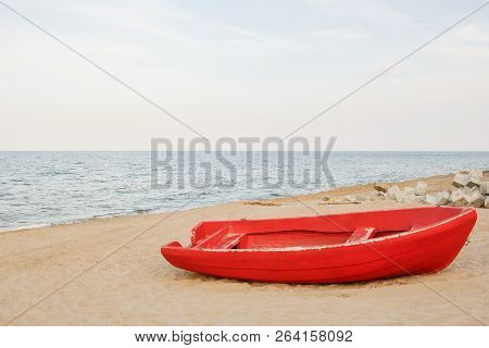 Old Red Boat On The Beach, Waves On The Water And Sky Background