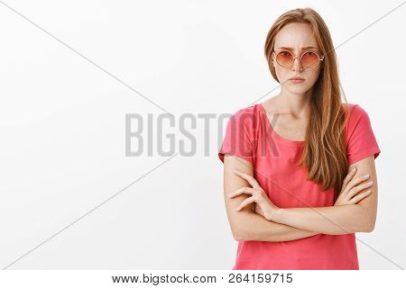 Angry Woman Waiting Explanations. Intense Serious-looking Displeased Redhead Girl With Freckles In S