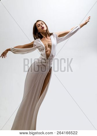 Beautiful Fairy Flying Girl In White Dress. Romantic Young Beauty As An Angel