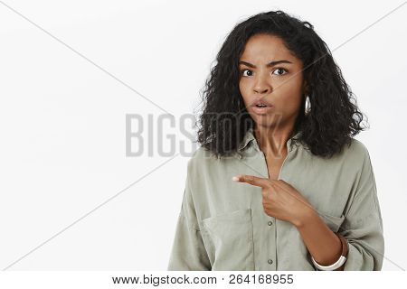Intense Unsure And Confused African American Female Coworker Asking Quesitoned About Suspicious Guy 