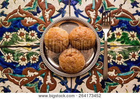 Turkish Dessert Kemalpasa On A Ottoman Pattern Surface.