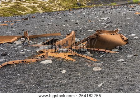 Twisted Rusty Metal On Djupalonssandur Beach, Iceland With More Background Showing.