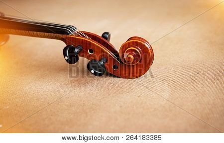 Two Different Size Of Violins Put On Background,warm Light Tone,blurry Light Adesign Background
