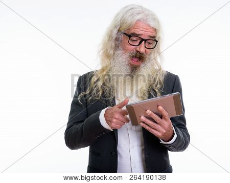Studio Shot Of Happy Senior Bearded Businessman Smiling And Laug