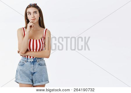 Hmmm Need To Think. Portrait Of Thoughtful Creative And Stylish Young Female Model In Striped Pin-up