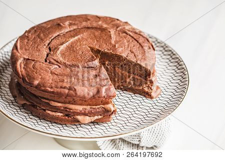 Vegan Chocolate Cake On A White Dish For Cake, Light Background. Healthy Vegan Food Concept.