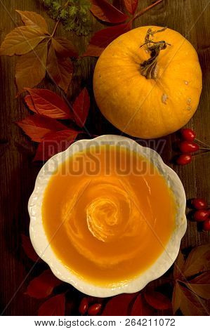 Pumpkin Soup On Wooden Background - Top View