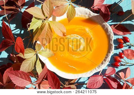Pumpkin Soup With The Fall Leaves - Top View