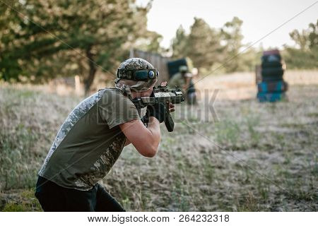 Man Playing Lasertag Shooting Game In Open Air