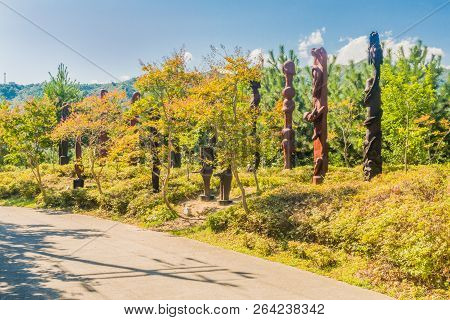Samcheok, South Korea; September 25, 2018: Group Of Wooden Statues Shaped Like Human Penis On Hillsi