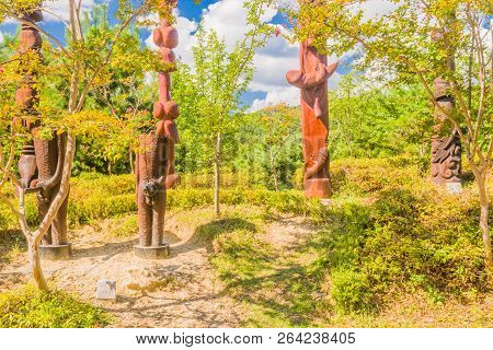 Samcheok, South Korea; September 25, 2018: Group Of Wooden Statues Shaped Like Human Penis On Hillsi