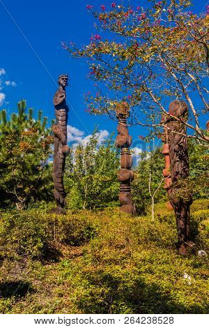 Samcheok, South Korea; September 25, 2018: Closeup Of Wooden Statues Shaped Like Human Penis Standin