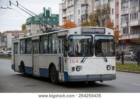 Yoshkar-ola. Russia - October 2018: Old White With A Blue Stripe A Trolleybus In The Center Of A Lar