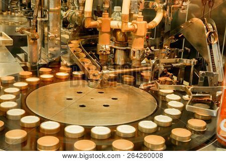 Cheese Cake Making Machine In The Bakery Factory Making And Drop Cheese Cake Ingredient In Molds To 